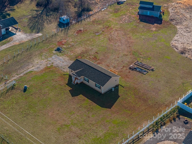 birds eye view of property with a rural view