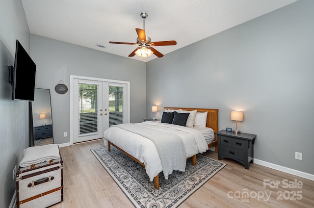 bedroom featuring access to exterior, french doors, visible vents, light wood-style floors, and baseboards