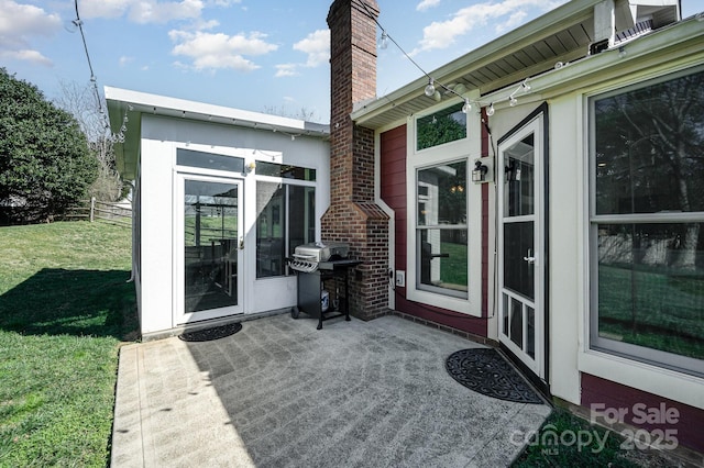 view of patio / terrace with fence and area for grilling