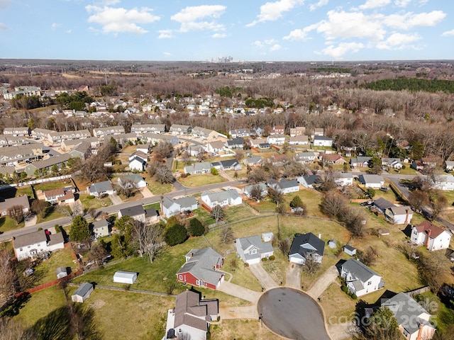 birds eye view of property with a residential view