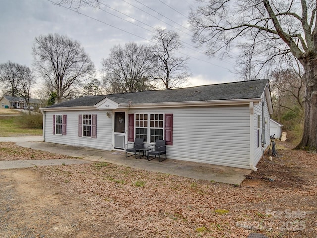 rear view of house featuring a patio area