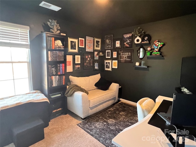 carpeted office space with visible vents