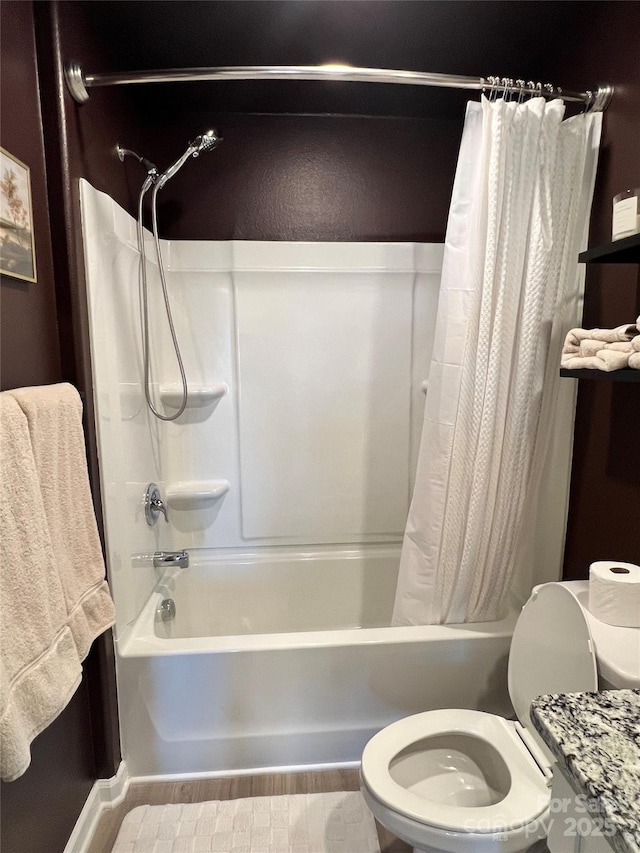 full bath with wood finished floors, toilet, and shower / bath combo with shower curtain