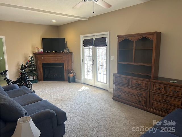 337 Knollwood Dr, Forest City, NC 28043 - living room with baseboards, light colored carpet, ceiling fan, french doors, and a fireplace