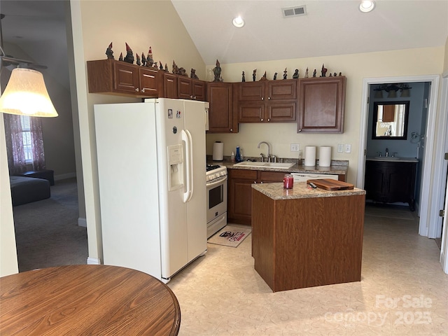 337 Knollwood Dr, Forest City, NC 28043 - kitchen featuring lofted ceiling, white appliances, a sink, a kitchen island, and visible vents