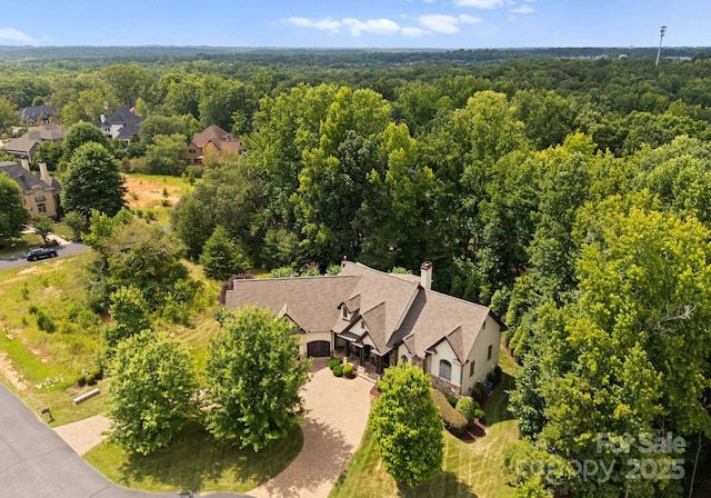 aerial view featuring a view of trees