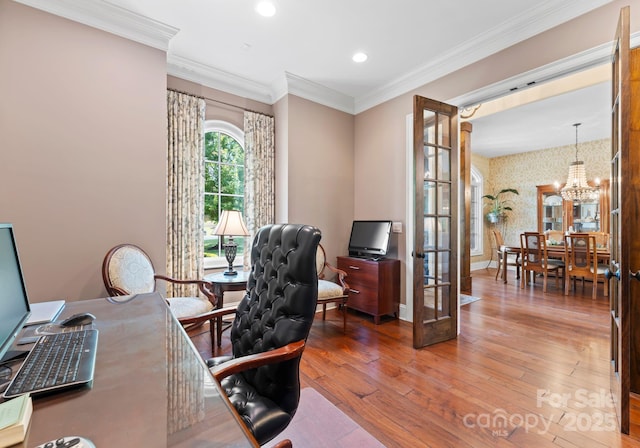 office featuring baseboards, ornamental molding, wood finished floors, french doors, and a notable chandelier