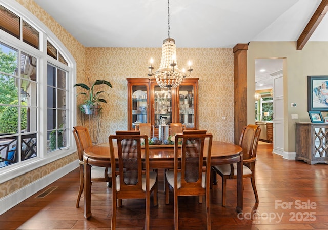 dining space featuring visible vents, dark wood finished floors, baseboards, and wallpapered walls