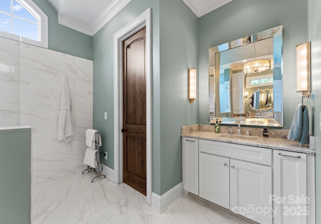 bathroom with baseboards, marble finish floor, vanity, and crown molding