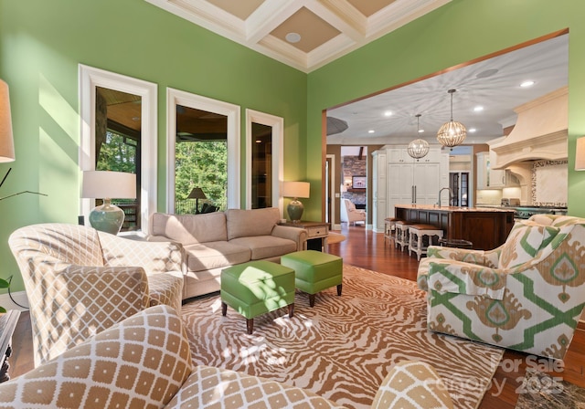 living area with ornamental molding, recessed lighting, coffered ceiling, and dark wood-style floors