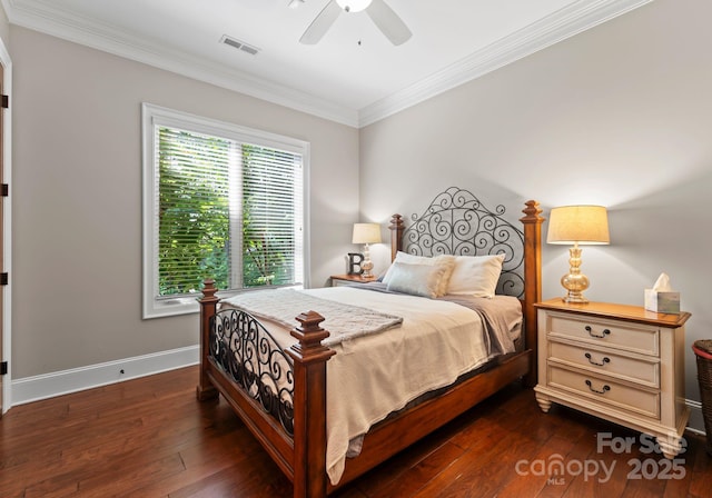 bedroom featuring baseboards, visible vents, dark wood-style floors, ceiling fan, and crown molding