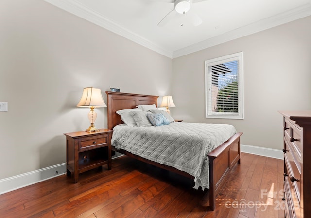 bedroom with dark wood-style floors, baseboards, a ceiling fan, and crown molding