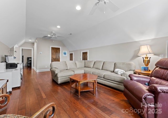 living room with lofted ceiling, dark wood finished floors, a ceiling fan, and baseboards