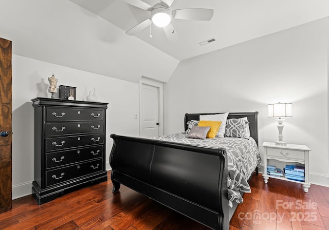 bedroom featuring lofted ceiling, ceiling fan, baseboards, and dark wood finished floors