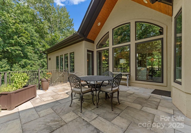 view of patio / terrace with a ceiling fan and outdoor dining area