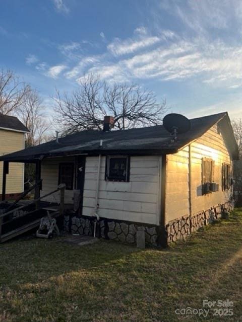 back of house with a yard