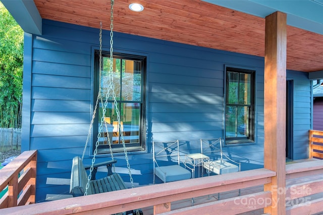 wooden terrace with covered porch