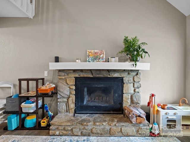 room details with wood finished floors and a fireplace