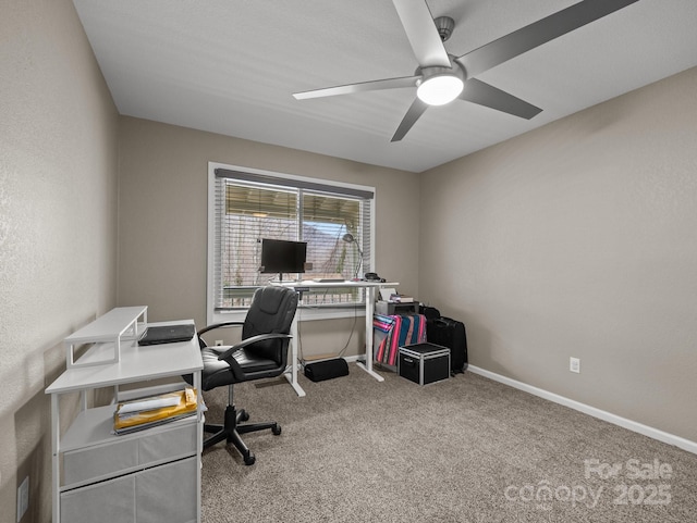 carpeted office with baseboards and ceiling fan