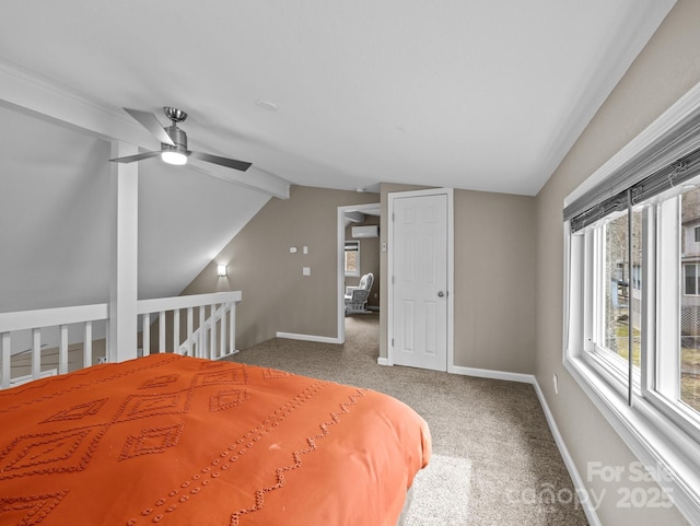 unfurnished bedroom featuring baseboards, a ceiling fan, vaulted ceiling with beams, and carpet flooring