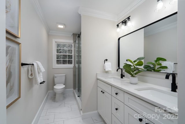 bathroom featuring toilet, marble finish floor, crown molding, and a sink