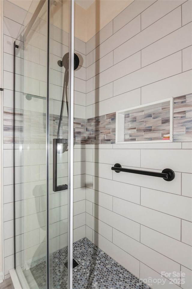 bathroom featuring a shower stall