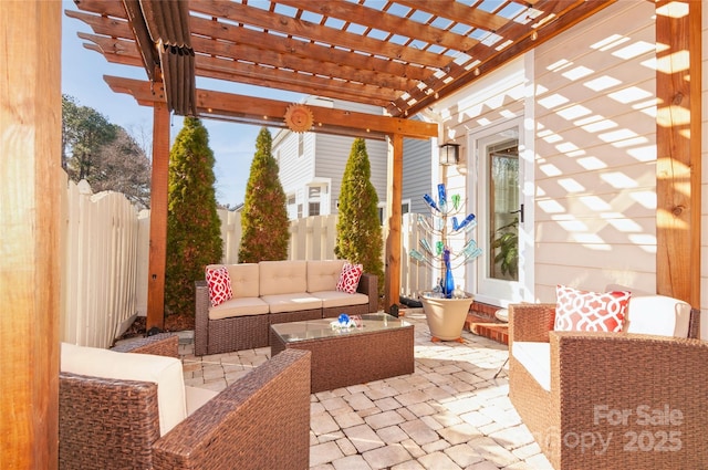 view of patio featuring fence, an outdoor living space, and a pergola