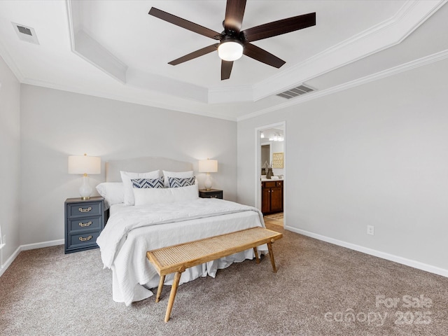 bedroom featuring light colored carpet, a tray ceiling, and visible vents