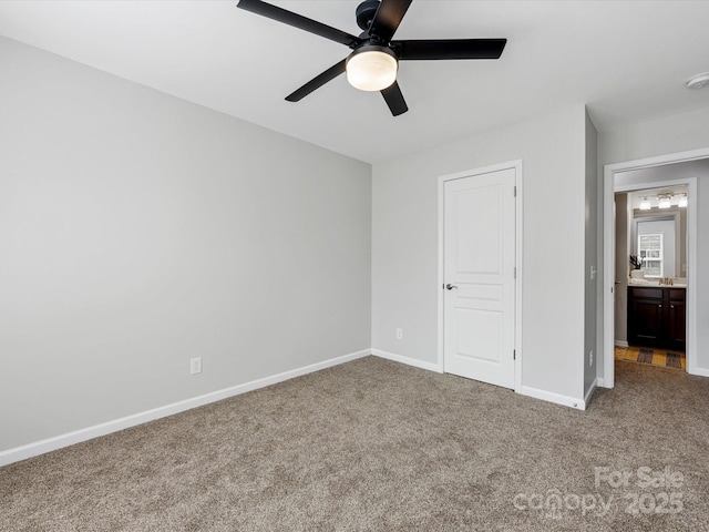 unfurnished bedroom featuring ceiling fan, baseboards, and carpet flooring