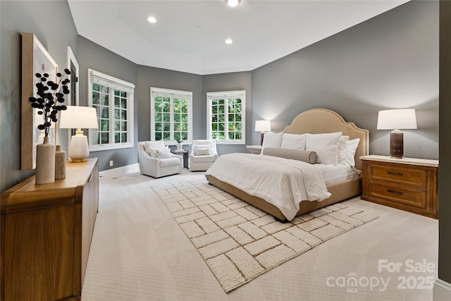 bedroom with light carpet, baseboards, and recessed lighting