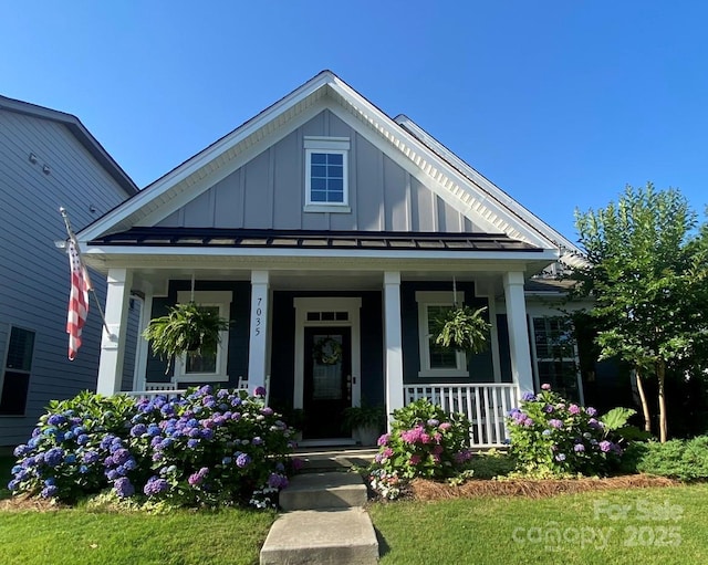 view of front of house with covered porch and board and batten siding