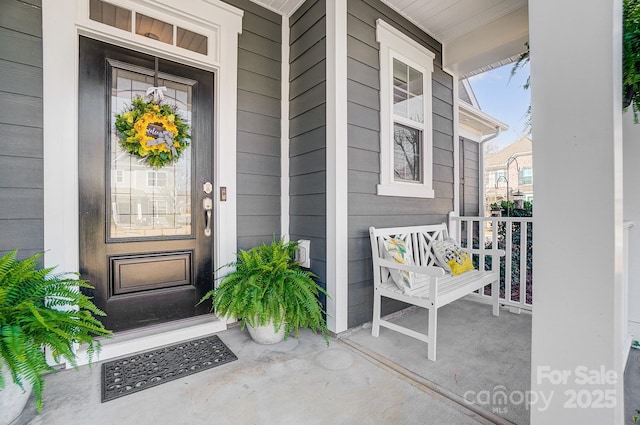 property entrance featuring a porch