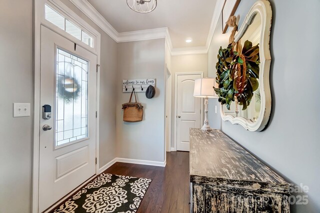 entryway with dark wood finished floors, baseboards, a wealth of natural light, and ornamental molding