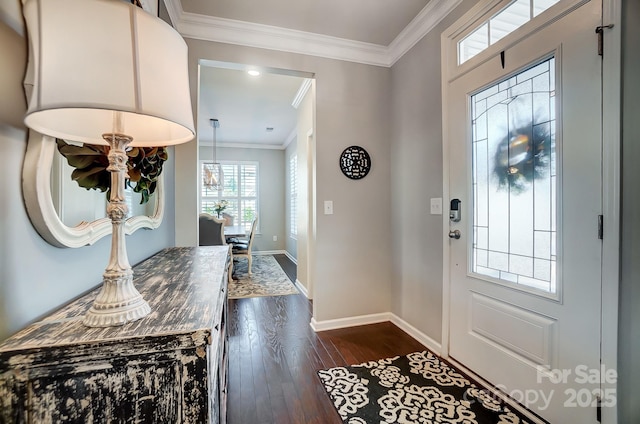 entryway with baseboards, crown molding, and dark wood-type flooring