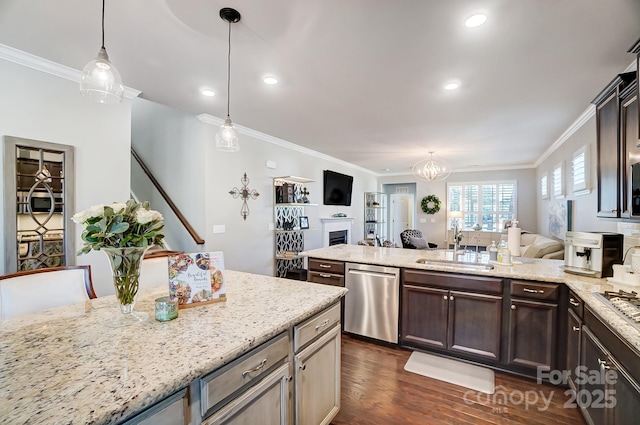 kitchen with a sink, stainless steel dishwasher, open floor plan, and ornamental molding