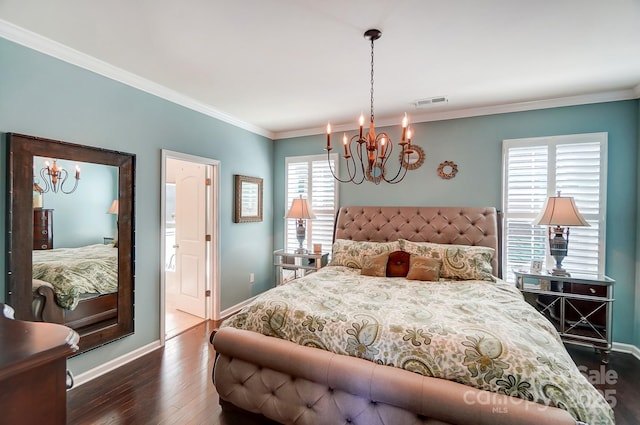 bedroom featuring visible vents, crown molding, baseboards, dark wood-type flooring, and a notable chandelier