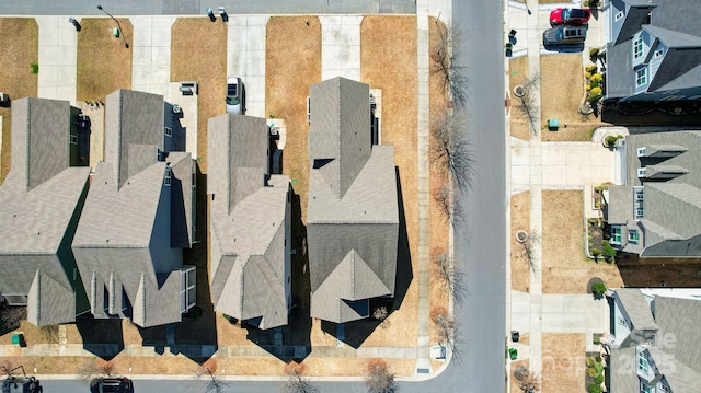 birds eye view of property with a residential view