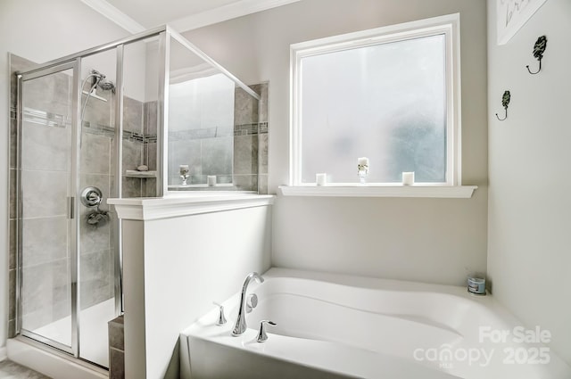 full bath featuring a stall shower, a garden tub, and ornamental molding