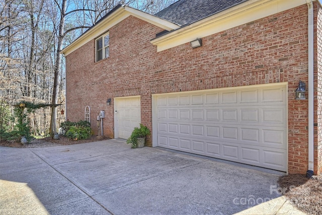 garage featuring driveway