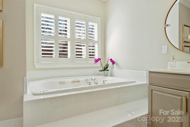 bathroom featuring vanity and a bath