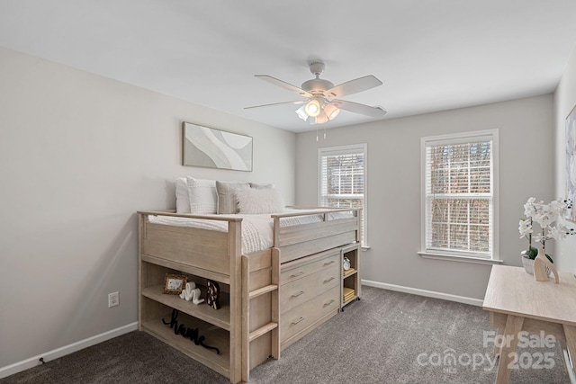 carpeted bedroom featuring a ceiling fan and baseboards