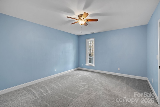 empty room featuring carpet floors, ceiling fan, and baseboards