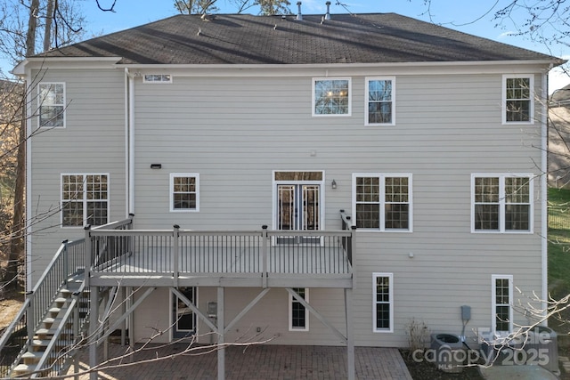 rear view of house featuring a patio, stairway, and a wooden deck