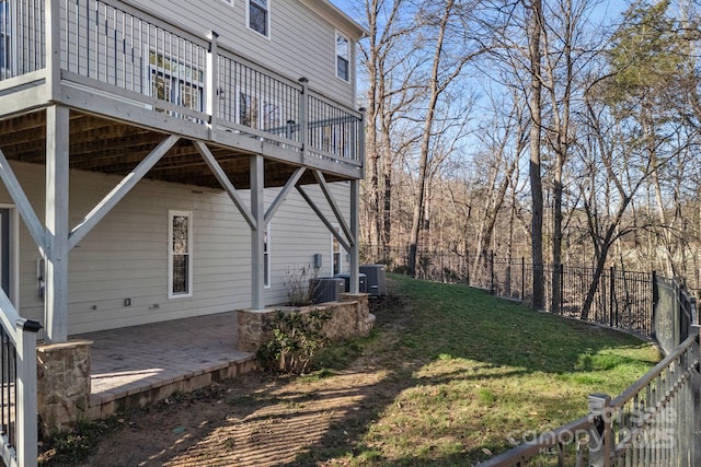 view of yard featuring a patio, central AC unit, fence private yard, and a wooden deck