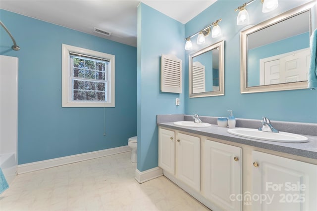 full bathroom featuring visible vents, a sink, toilet, and double vanity