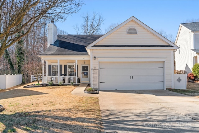 view of front of property with fence, covered porch, a chimney, concrete driveway, and a garage