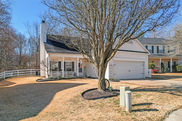 view of front of house with fence, driveway, a porch, an attached garage, and a front lawn