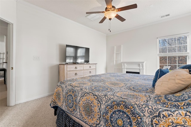 bedroom featuring visible vents, baseboards, carpet flooring, and crown molding