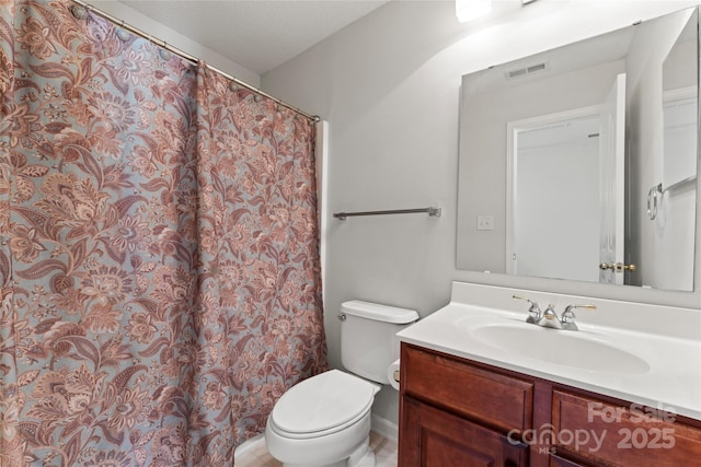 full bath featuring visible vents, toilet, and vanity