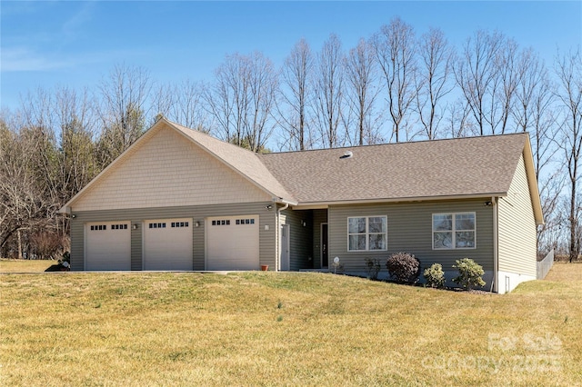 view of front of property with a garage, driveway, roof with shingles, and a front yard